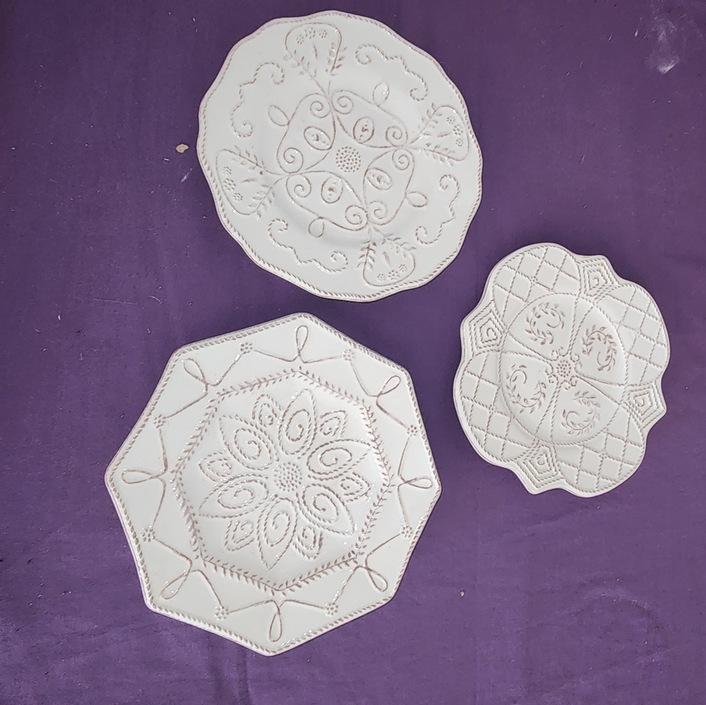 Set of 3 small plates with raised embossed design.